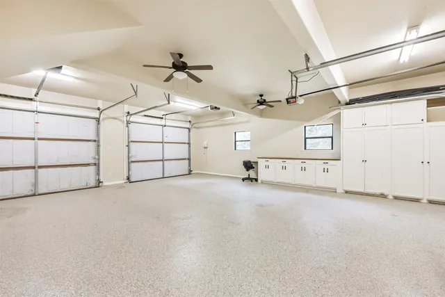 a view of a two chairs in the balcony