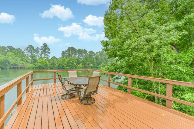 a view of a house with swimming pool and sitting area