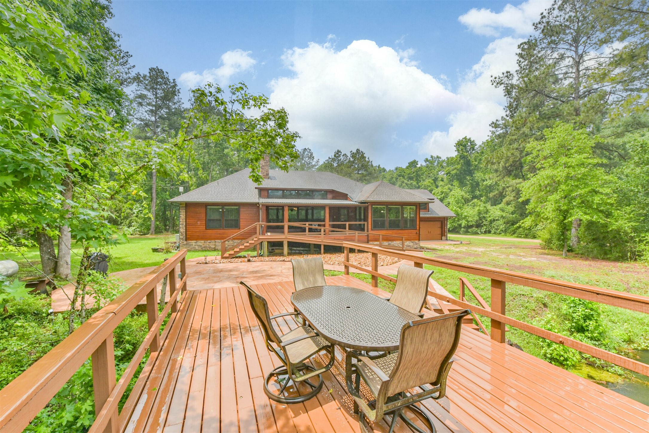 46 Deer Ridge Cleveland, TX 77327 - Photo 33 of 40 a view of a house with swimming pool and sitting area