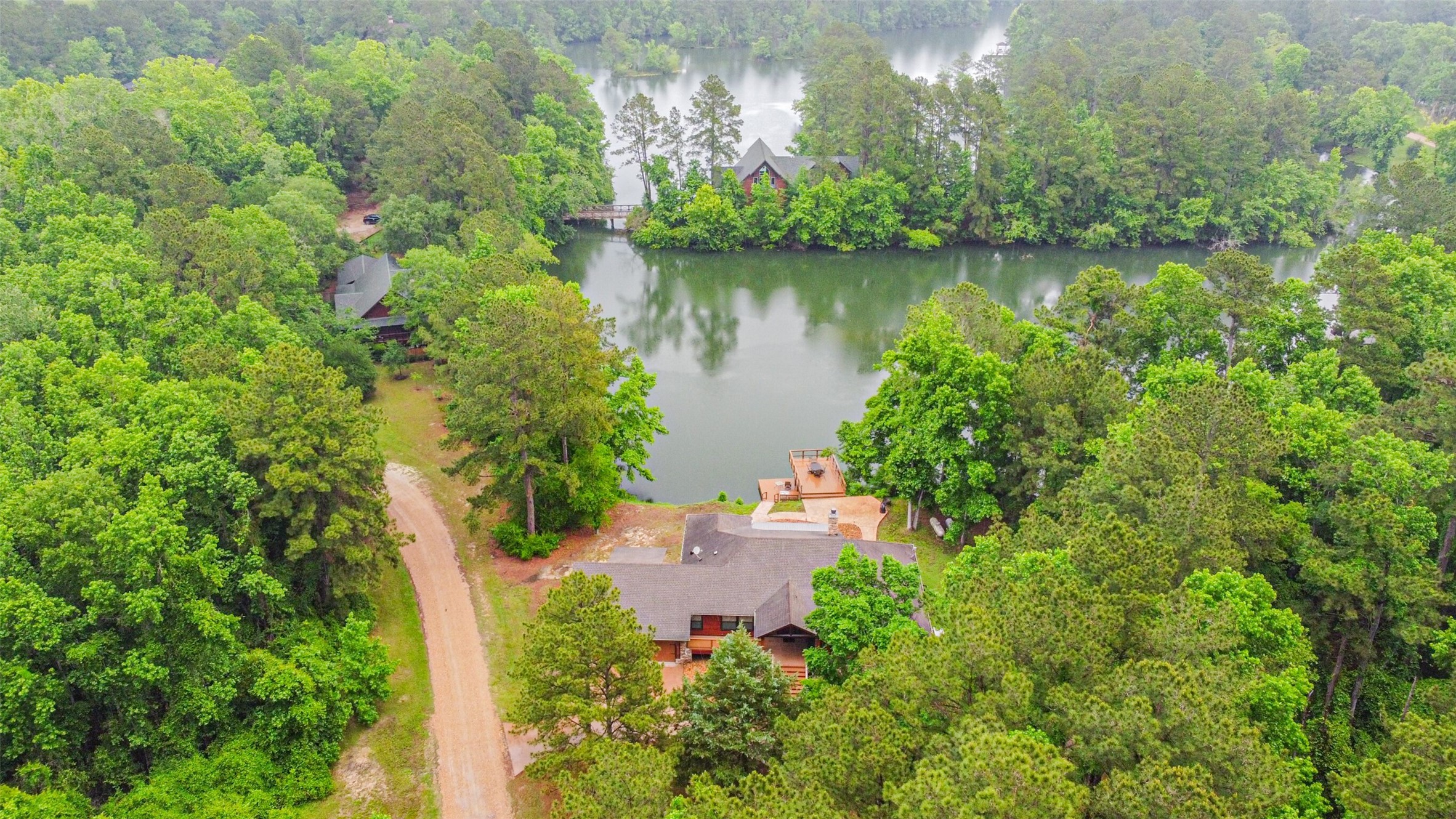 46 Deer Ridge Cleveland, TX 77327 - Photo 36 of 40 a backyard of a house with lots of green space and lake view