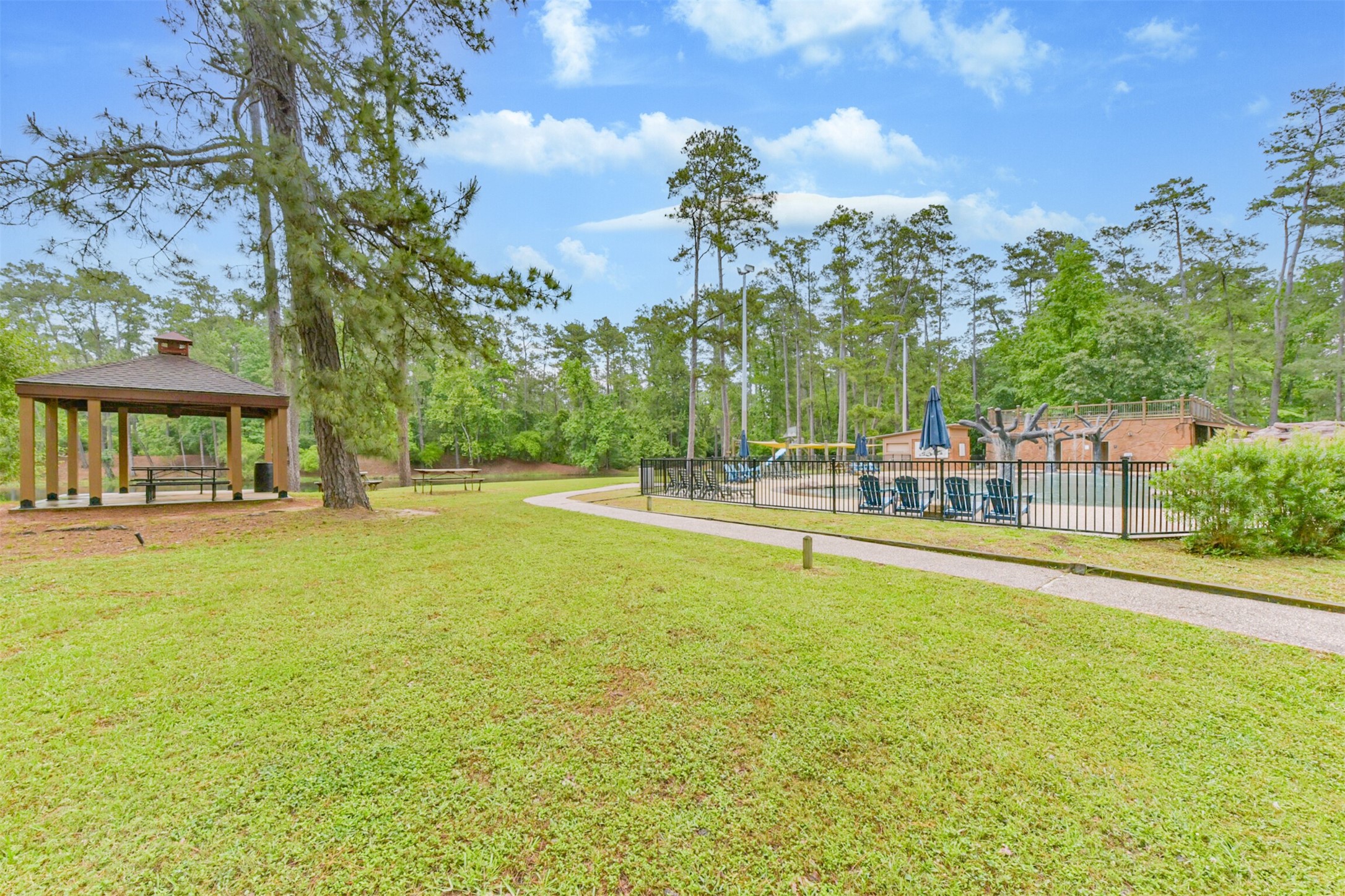 46 Deer Ridge Cleveland, TX 77327 - Photo 37 of 40 a swimming pool with outdoor seating and yard
