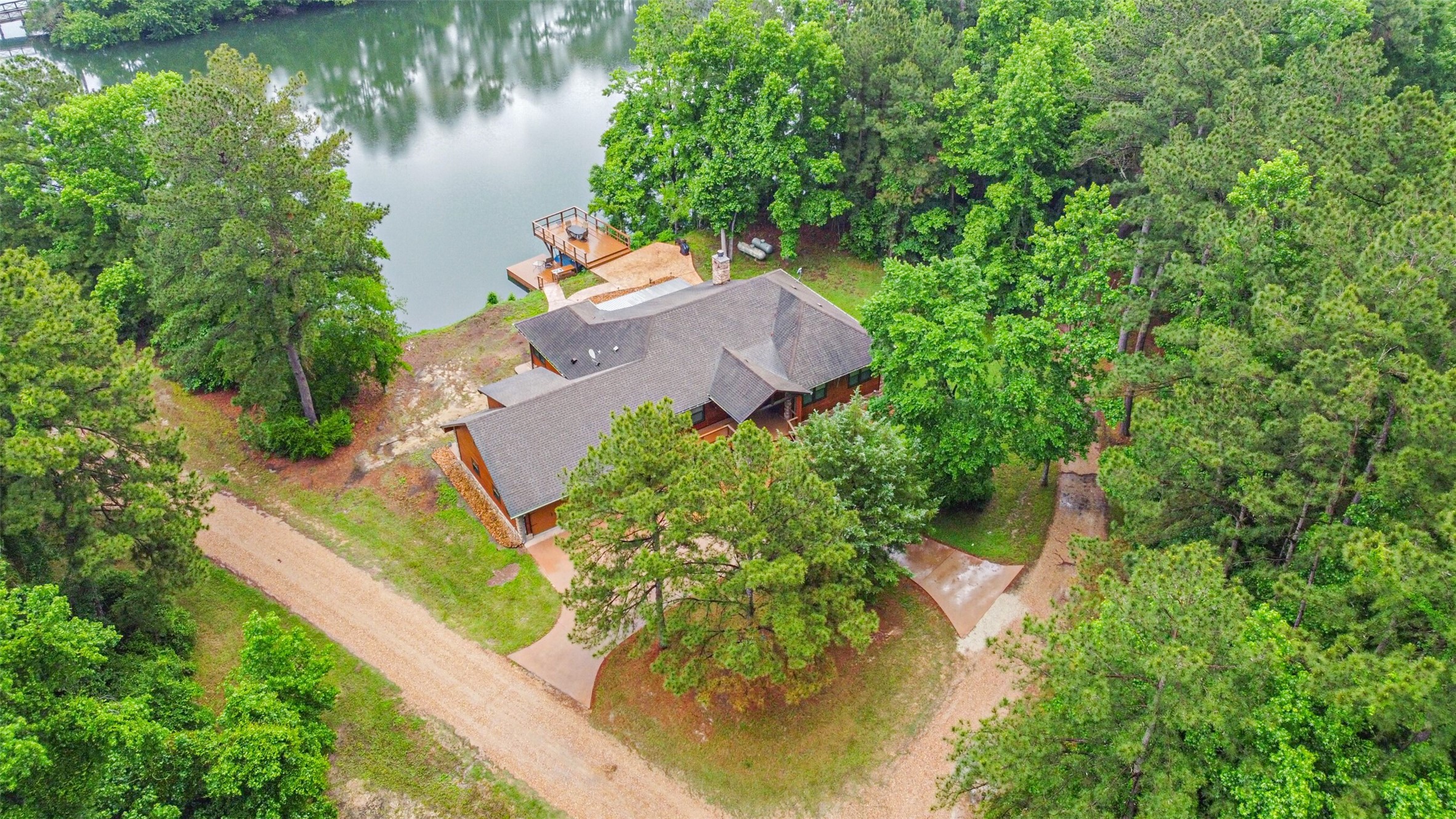 46 Deer Ridge Cleveland, TX 77327 - Photo 4 of 40 an aerial view of a house with a yard and lake view