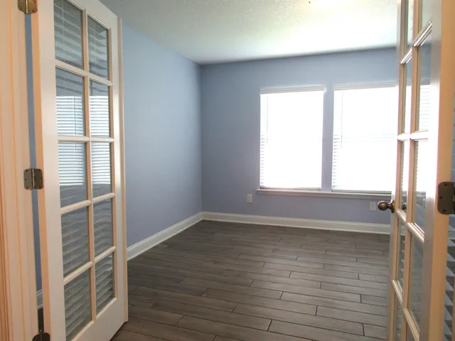 a view of an empty room with a window