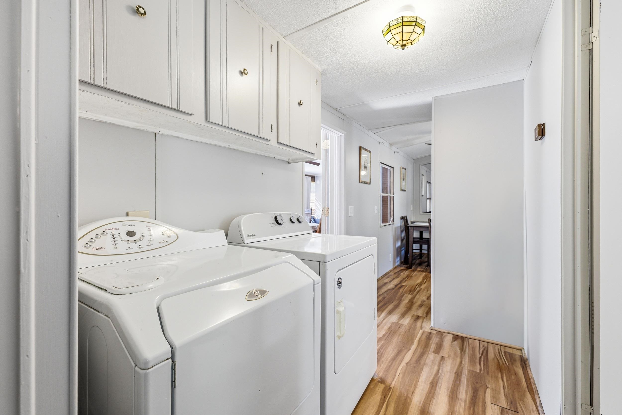 702 Richview Road Rileyville, VA 22650 - Photo 34 of 75 a view of washer and dryer with kitchen in the background