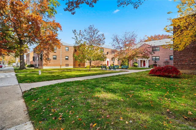 a view of a building with a yard
