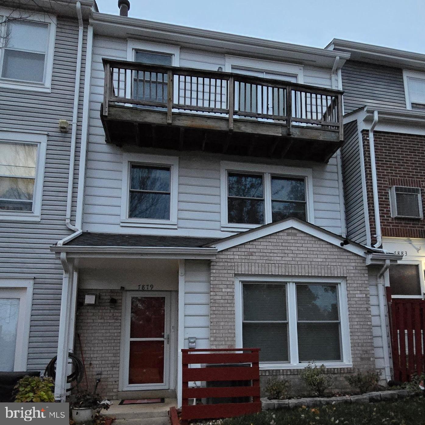 a front view of a house with a balcony