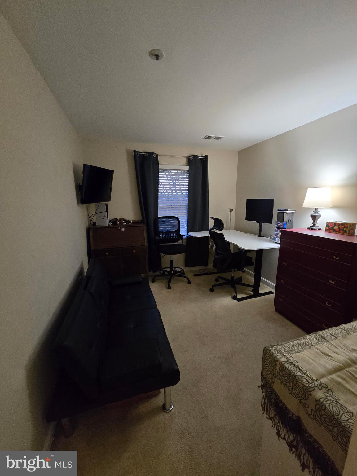 7879 Apache Ridge Court Manassas, VA 20109 - Photo 14 of 22 a living room with furniture and a lamp