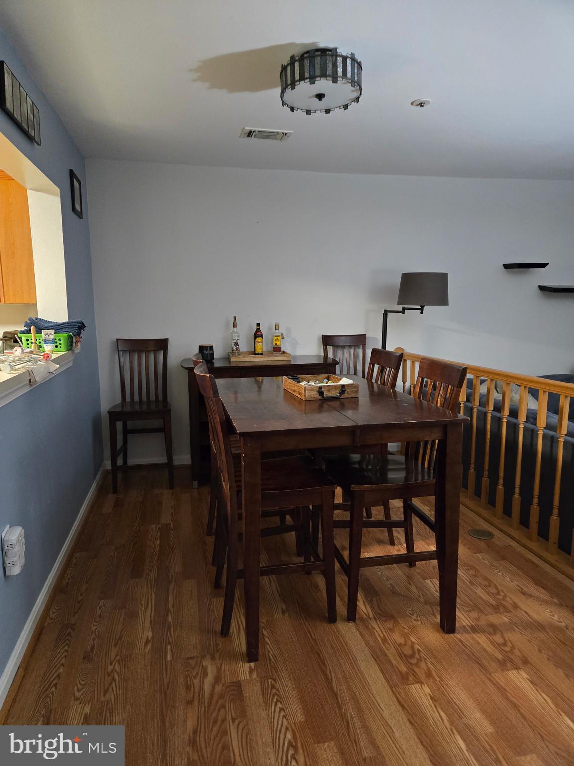7879 Apache Ridge Court Manassas, VA 20109 - Photo 3 of 22 a view of a dining room with furniture and wooden floor