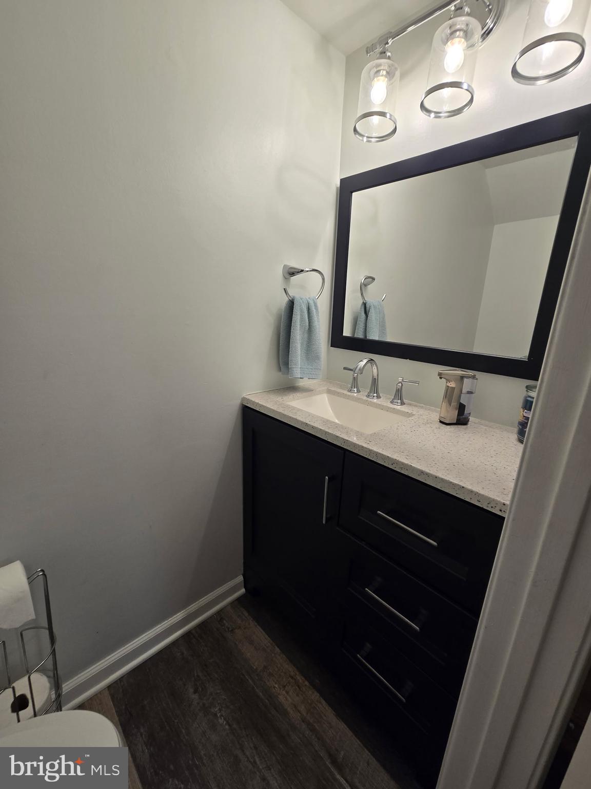 7879 Apache Ridge Court Manassas, VA 20109 - Photo 10 of 22 a bathroom with a sink vanity and mirror