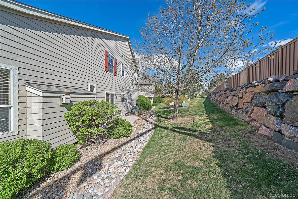6310 Trailhead Road Highlands Ranch, CO 80130 - Photo 21 of 23 a front view of a house with garden