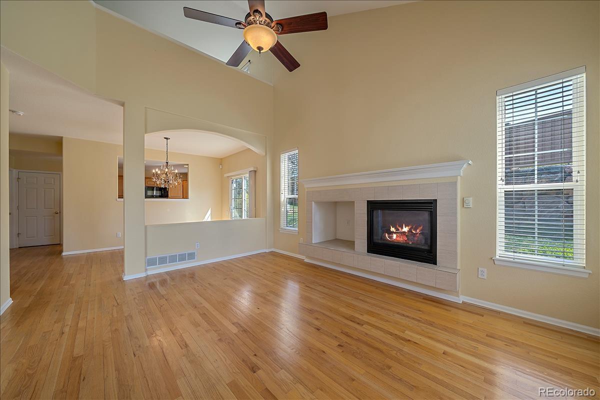 6310 Trailhead Road Highlands Ranch, CO 80130 - Photo 3 of 23 a view of an empty room with a fireplace and a window