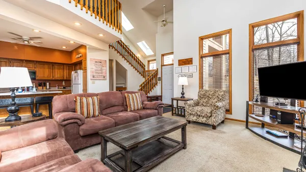 a bedroom with a large bed and a large window