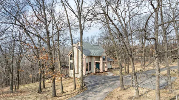 a bathroom with a granite countertop sink mirror and a bathtub