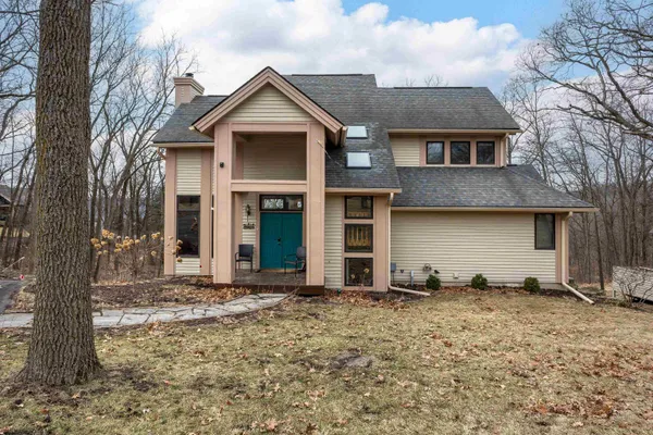 a bedroom with a bed and a table in it