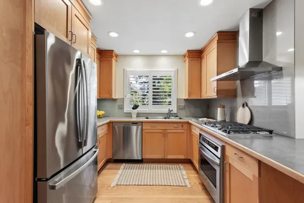 a kitchen with a sink cabinets and window