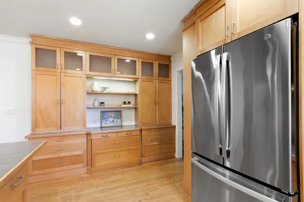 a stove top oven sitting inside of a kitchen