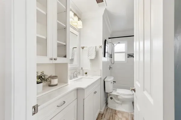 a bathroom with a shower and a bath tub