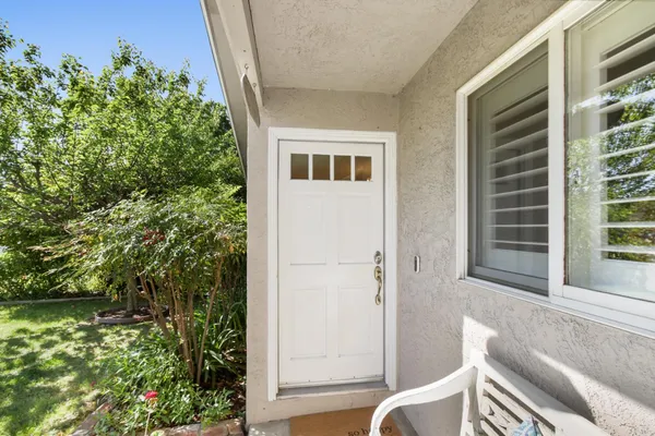 a living room with furniture a window and a table