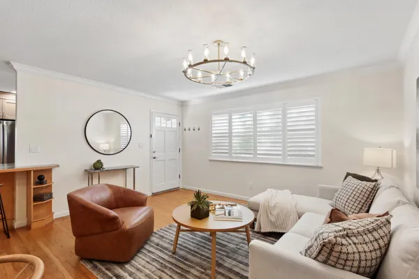 a kitchen with stainless steel appliances granite countertop a stove refrigerator and cabinets
