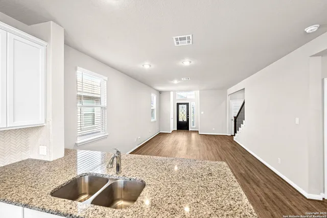 a kitchen with a table and chairs in it
