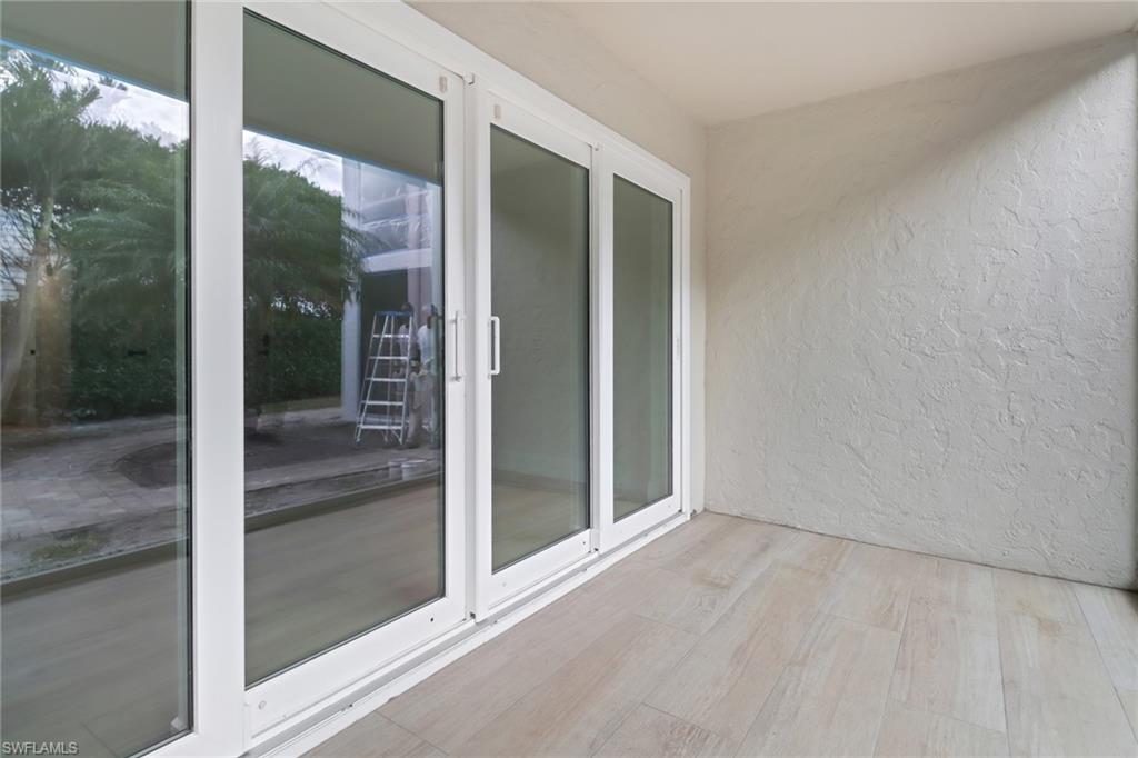 4150 Crayton Road, Unit B3 Naples, FL 34103 - Photo 14 of 19 a view of backyard with green space