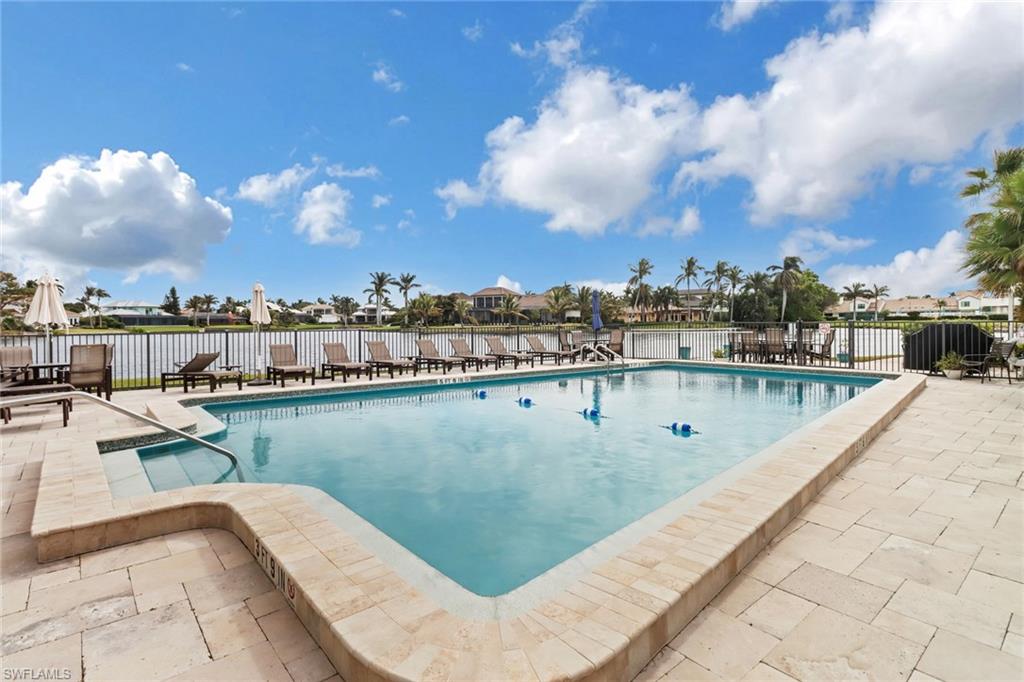 4150 Crayton Road, Unit B3 Naples, FL 34103 - Photo 15 of 19 a view of a swimming pool with a lake view
