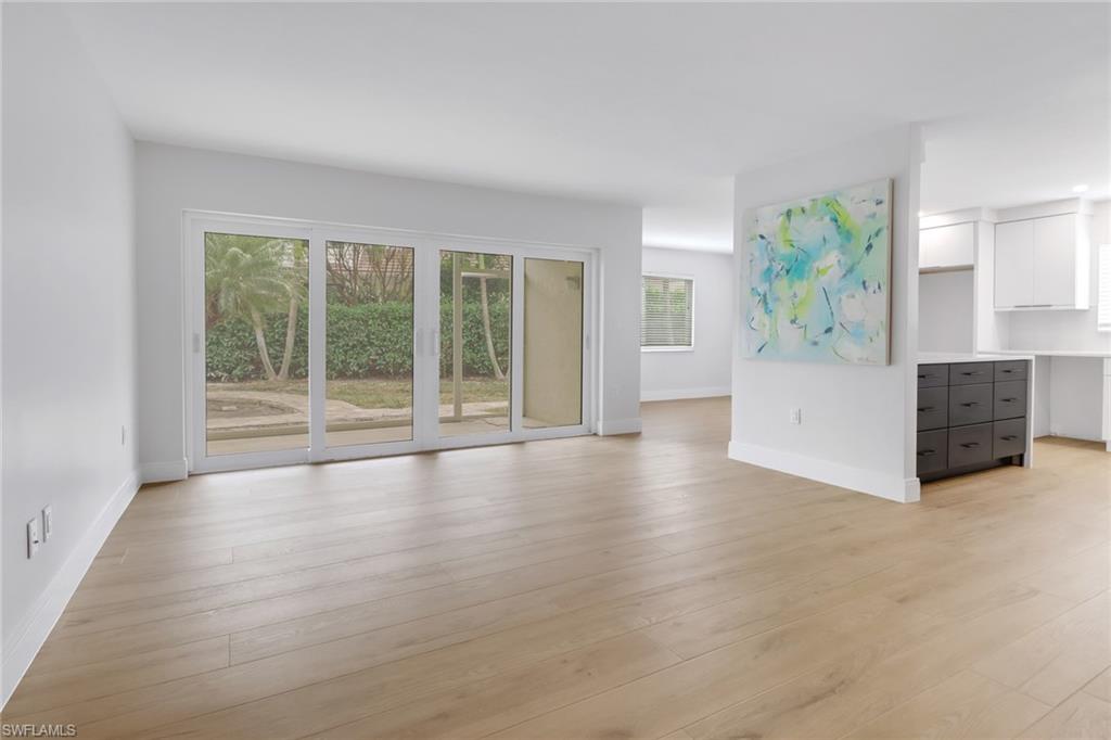 4150 Crayton Road, Unit B3 Naples, FL 34103 - Photo 3 of 19 an empty room with windows and mountain view