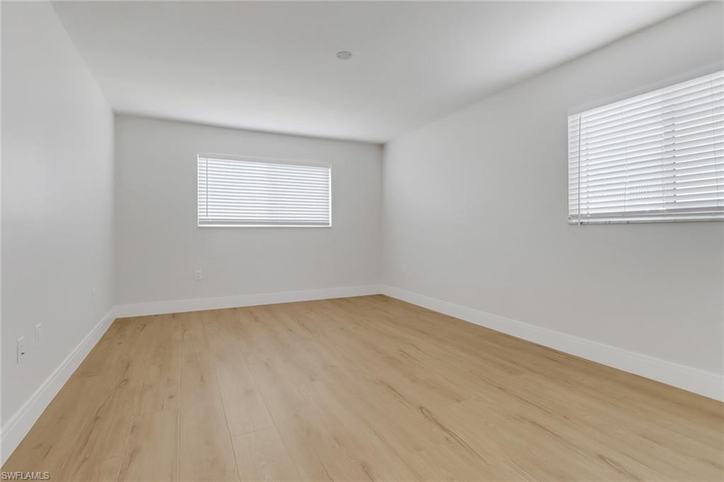 4150 Crayton Road, Unit B3 Naples, FL 34103 - Photo 9 of 19 an empty room with a window