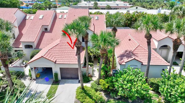 a view of a patio with table and chairs and potted plants