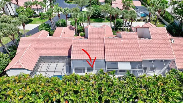 an aerial view of a house with a garden