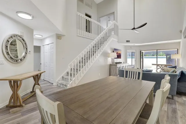 a dining room with furniture and wooden floor