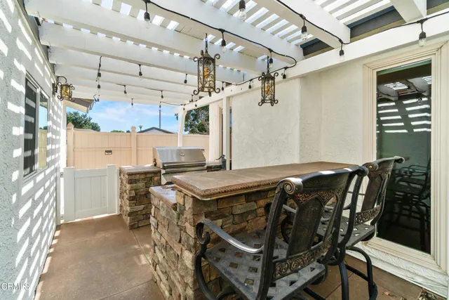 a view of a kitchen with a table and chairs