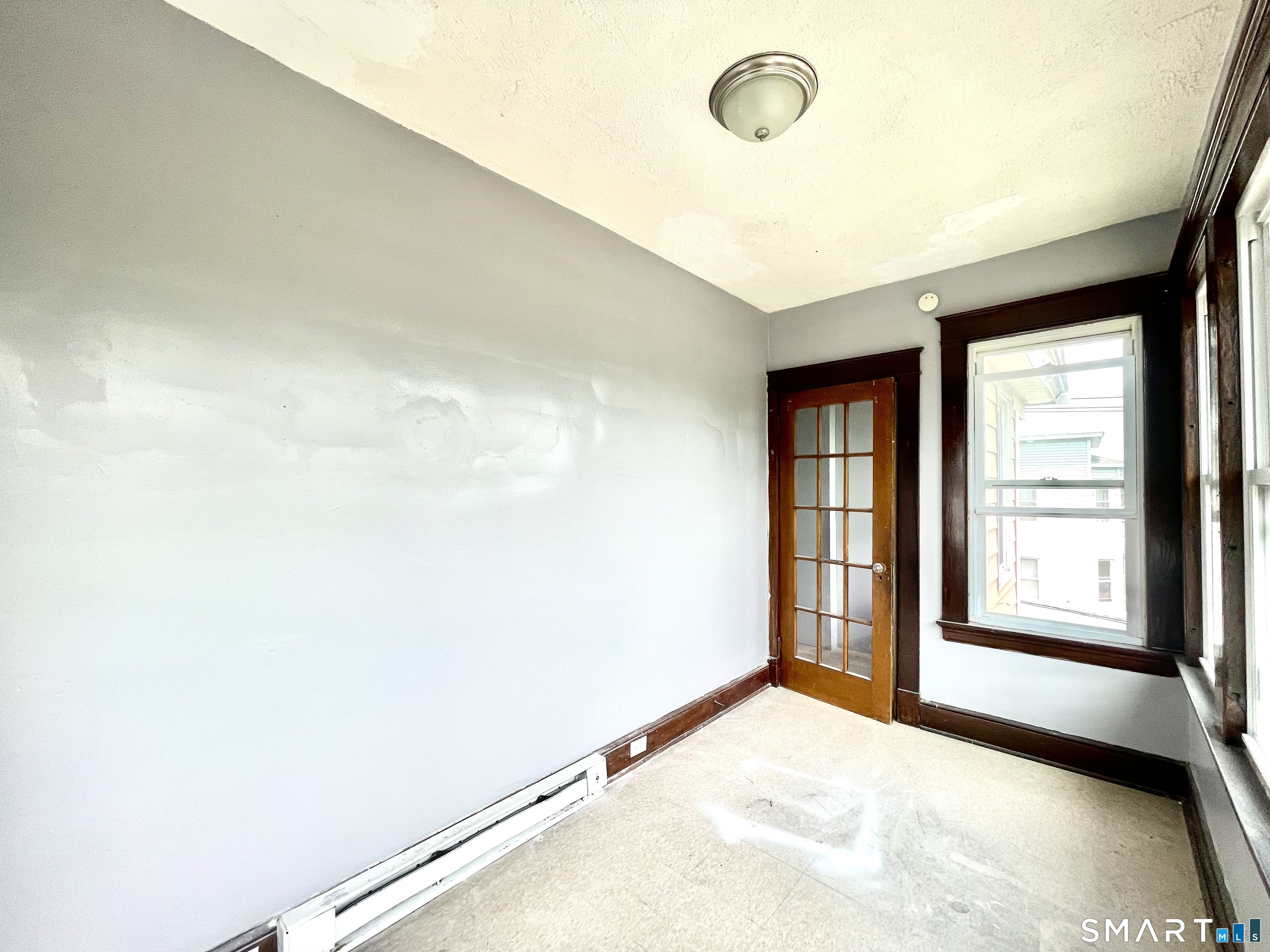 146 Charles Street, Unit 3 Waterbury, CT 06708 - Photo 15 of 20 an empty room with windows