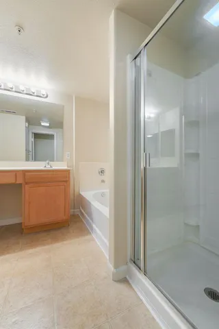 a bathroom with a bathtub and a shower