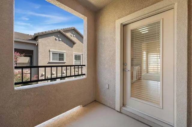 a view of a house with wooden floor and a window