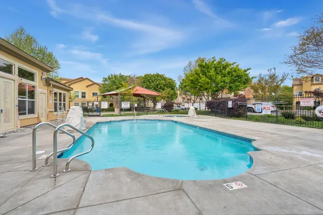 a view of a swimming pool with a lounge chairs