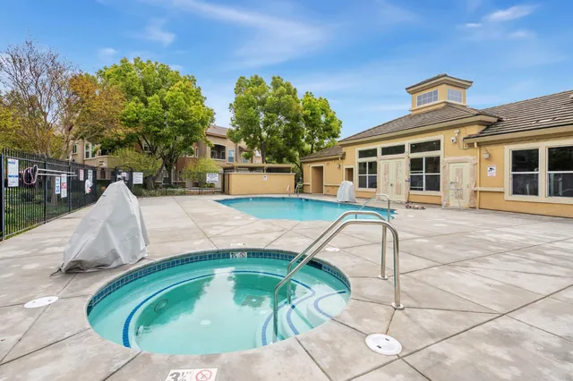 a view of a house with swimming pool