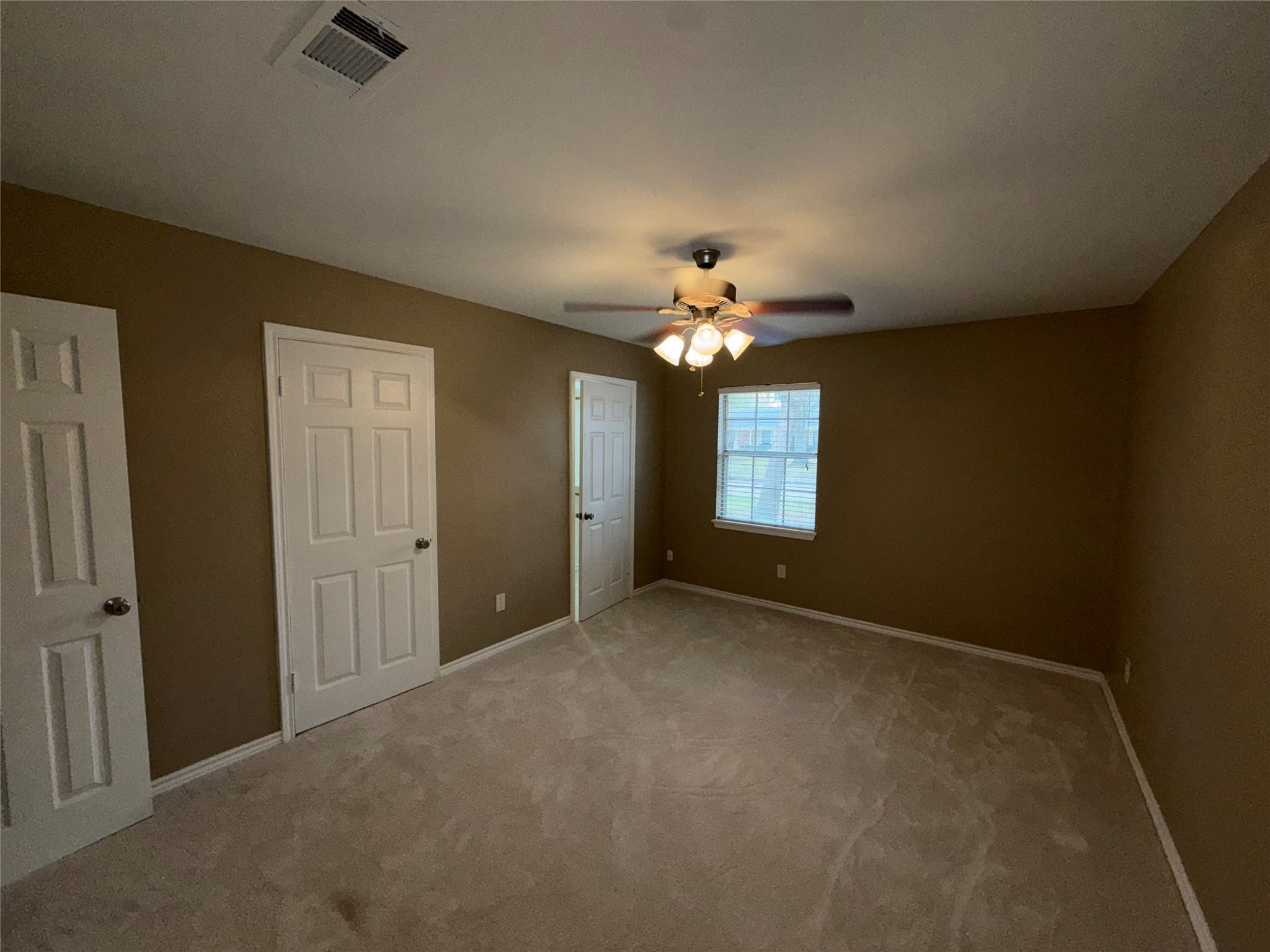 7306 Troulon Drive Houston, TX 77074 - Photo 15 of 16 a view of an empty room with a chandelier fan