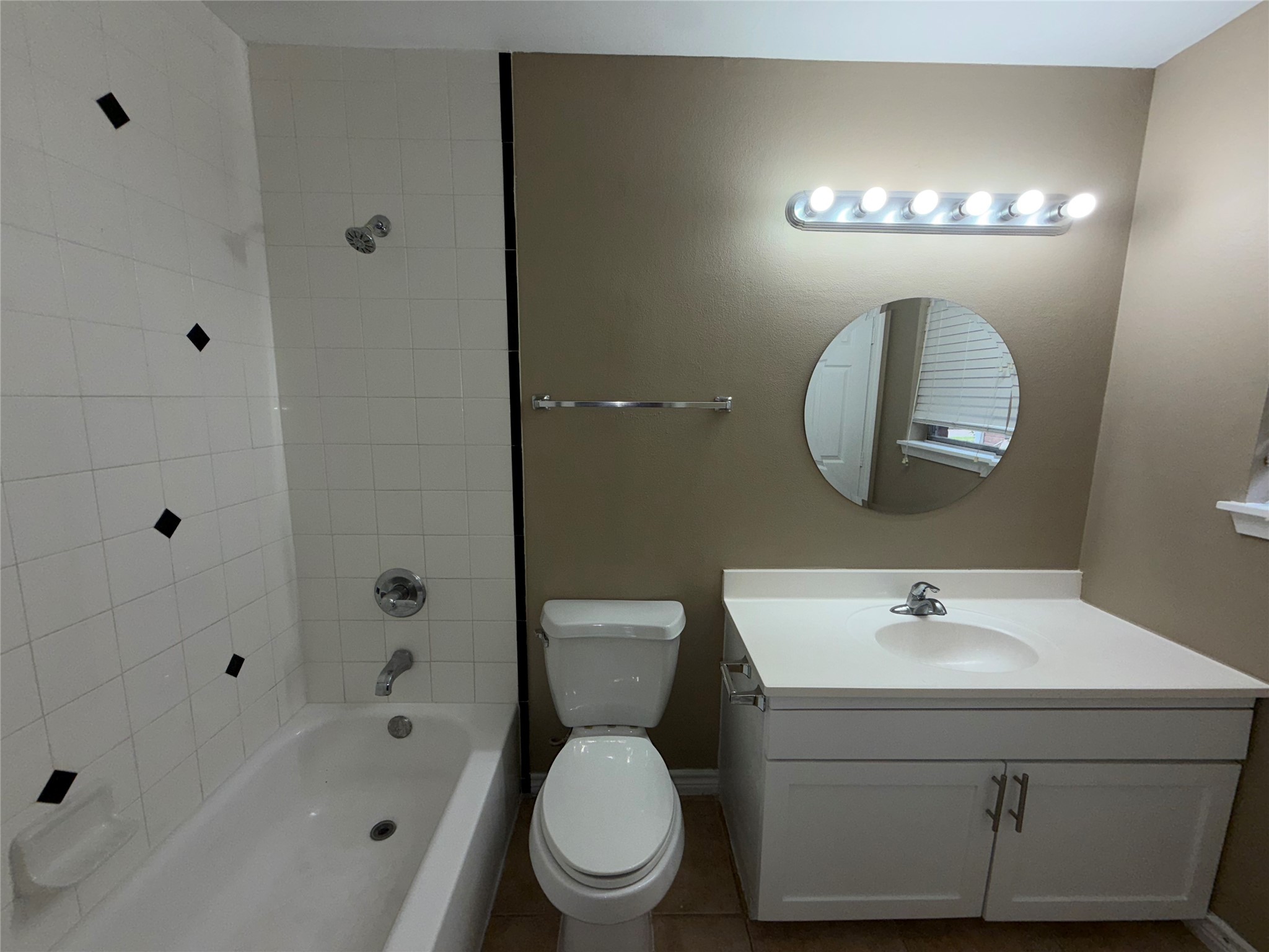 7306 Troulon Drive Houston, TX 77074 - Photo 16 of 16 a bathroom with a toilet sink and shower