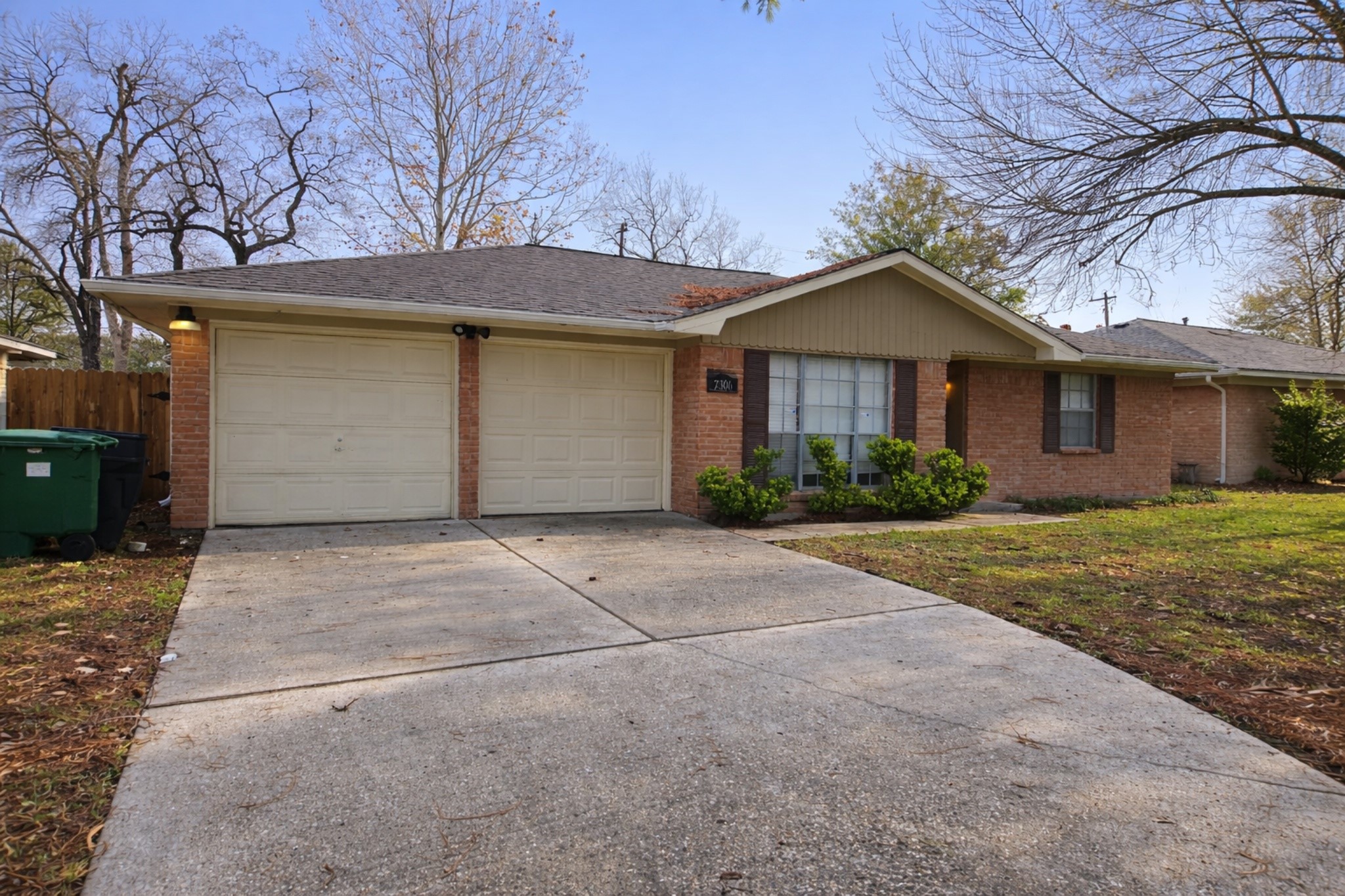 7306 Troulon Drive Houston, TX 77074 - Photo 2 of 16 a view of a house with a yard and large tree