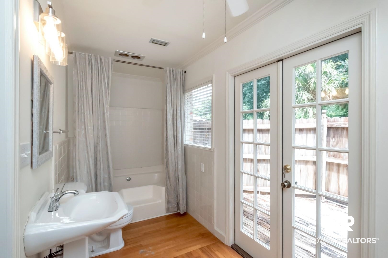 1906 Old Shell Road Mobile, AL 36607 - Photo 24 of 26 Bathroom featuring ornamental molding, sink, french doors, and hardwood / wood-style floors