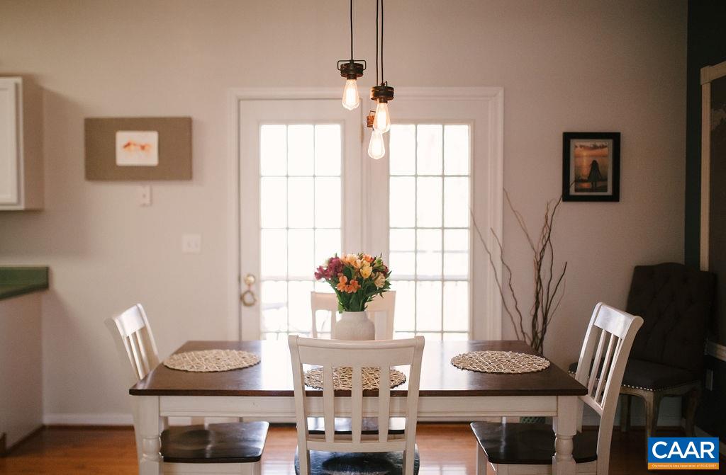 141 Tulip Road Ruckersville, VA 22968 - Photo 17 of 47 a view of a dining room with furniture and chandelier