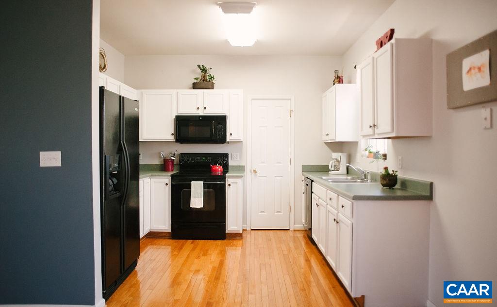 141 Tulip Road Ruckersville, VA 22968 - Photo 20 of 47 a kitchen with stainless steel appliances granite countertop a refrigerator and a stove top oven