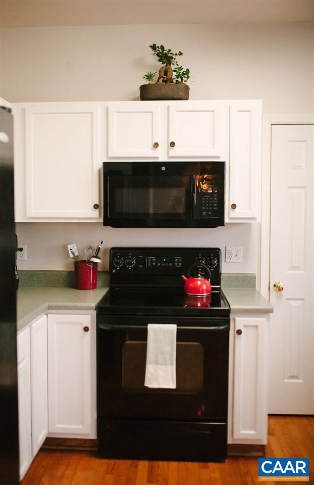 141 Tulip Road Ruckersville, VA 22968 - Photo 23 of 47 a kitchen with stainless steel appliances granite countertop a stove and a microwave