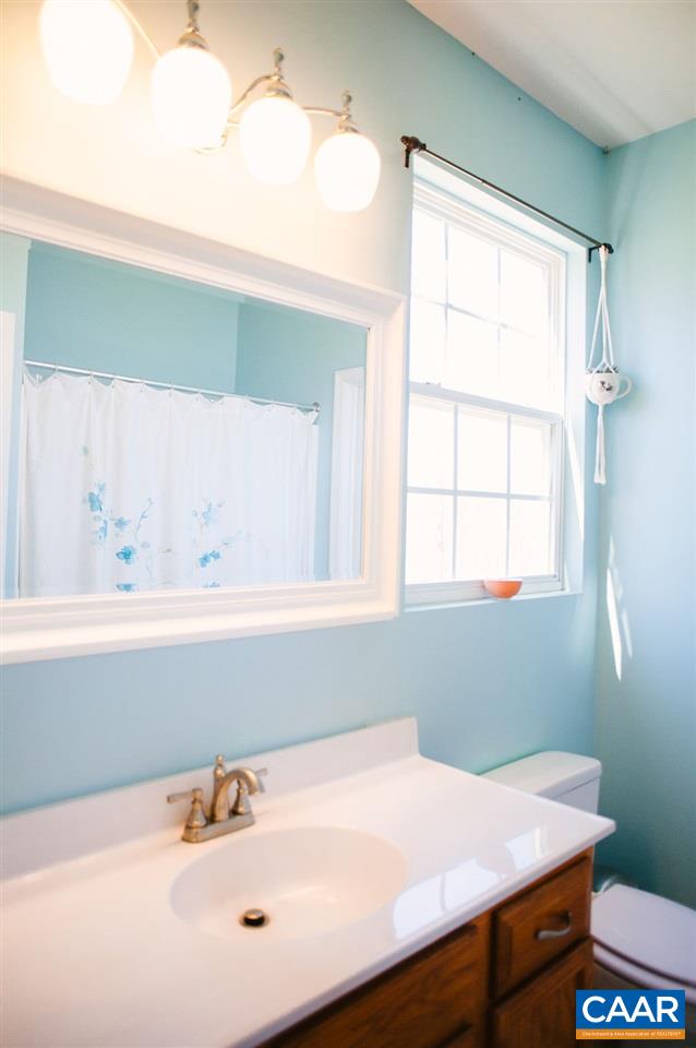 141 Tulip Road Ruckersville, VA 22968 - Photo 28 of 47 a bathroom with a sink and a window