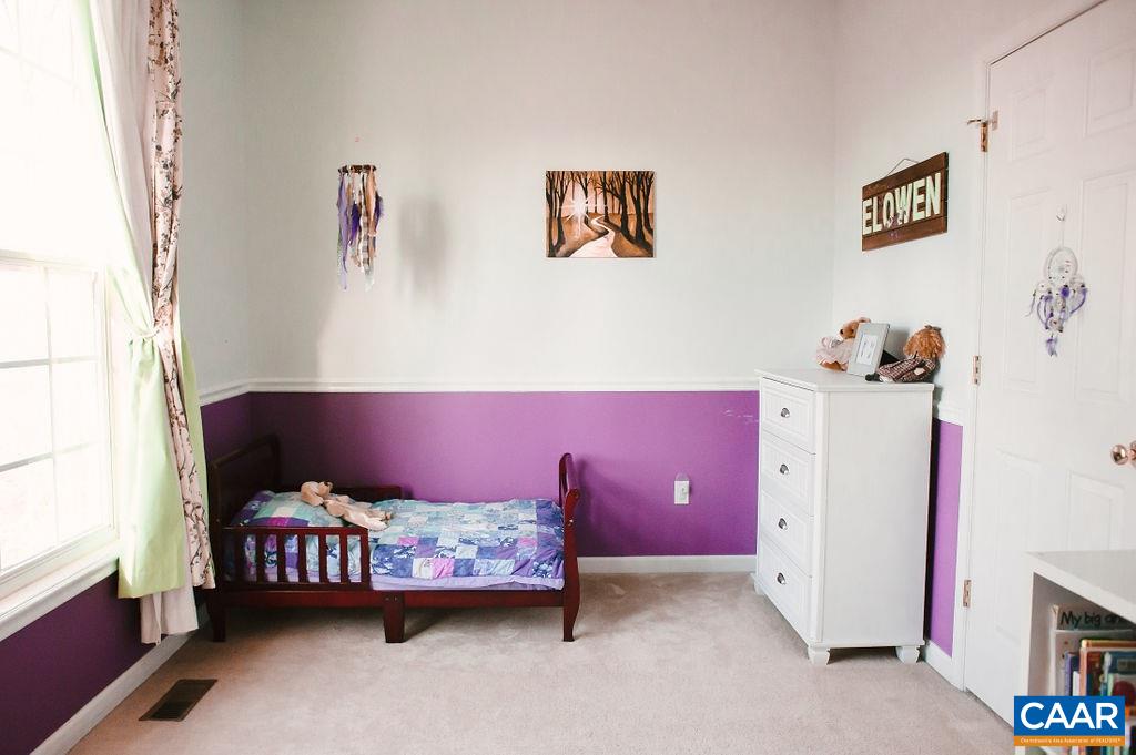 141 Tulip Road Ruckersville, VA 22968 - Photo 32 of 47 a bedroom with a bed and a window
