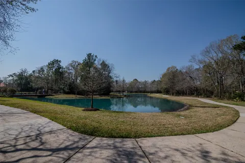a view of a backyard with swimming pool
