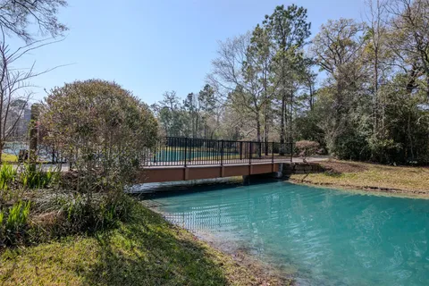 a view of a swimming pool with a yard