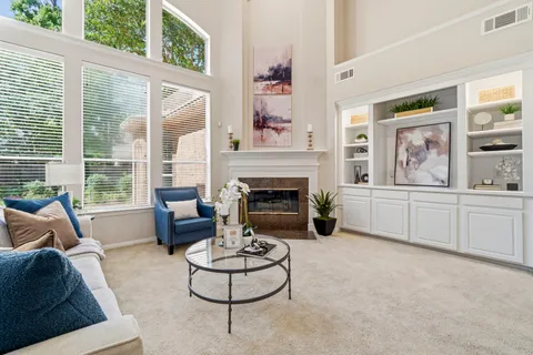 a living room with furniture and a fireplace