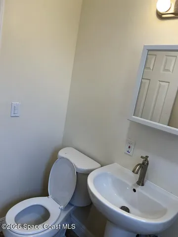 a bathroom with a toilet and a sink